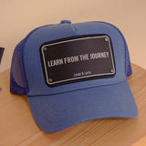 Levai & Loris Learn From The Journey unisex cap | Orange and White Hand Bouquet